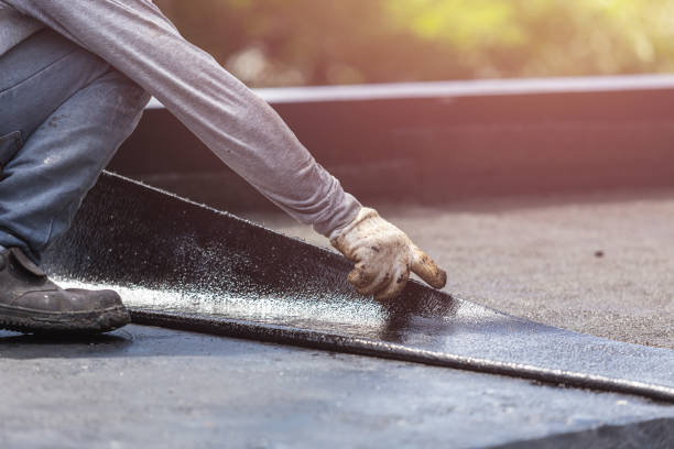 Professional Basement Waterproofing technician working in Harrisburg, IL